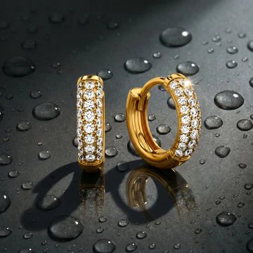 Pavé diamond huggie hoop earrings in gold on dark slate