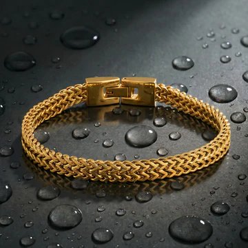 Men's foxtail chain bracelet in gold on dark slate